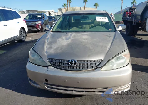 2002 Toyota Camry Le z USA, uszkodzony, nr VIN JTDBE32K120127837